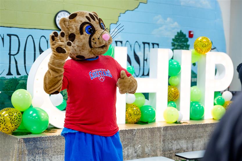 Students build a cheetah at a community event